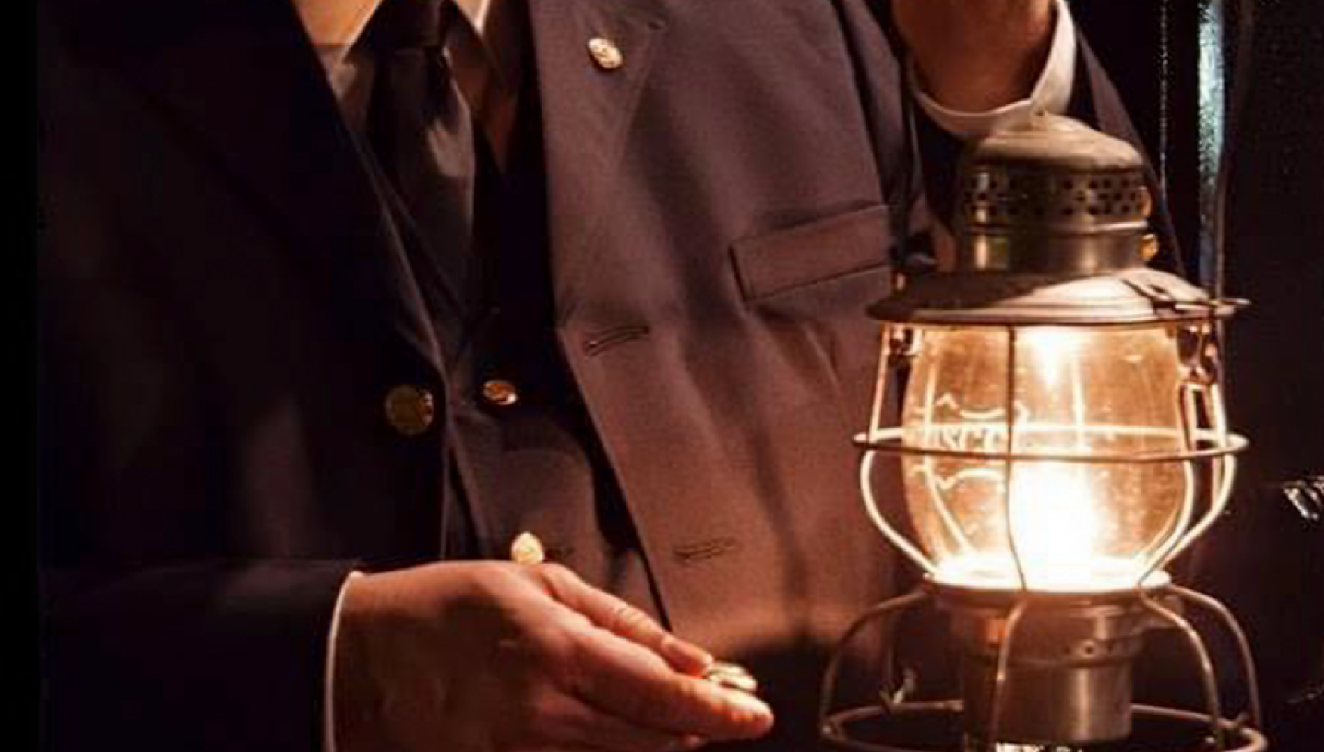 Conductor Checking His Watch by lantern light